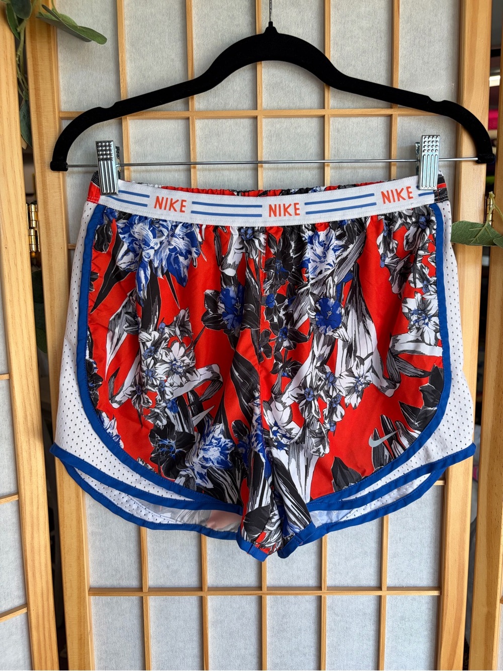 Nike Women’s Red Floral Athletic Shorts with Blue Trim